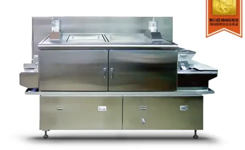 全自動炊飯装置「MSC-200」の外観写真。業務用の大型炊飯機で、連続的な炊飯が可能なステンレス製の機体