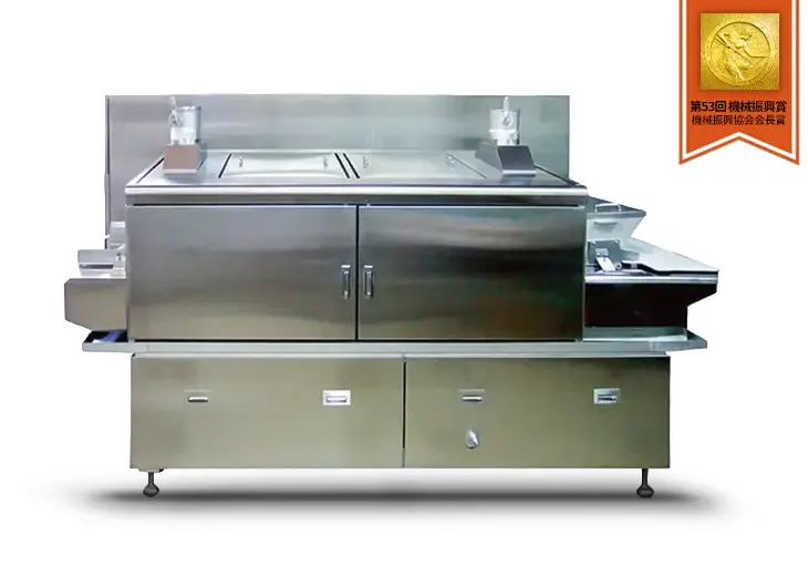 全自動炊飯装置「MSC-200」の外観写真。業務用の大型炊飯機で、連続的な炊飯が可能なステンレス製の機体